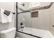 Shower and toilet inside this bathroom with glass door at 16201 S 29Th Ave, Phoenix, AZ 85045