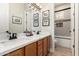 Bathroom featuring double vanity and walk-in shower at 16201 S 29Th Ave, Phoenix, AZ 85045