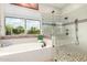 Bright bathroom showcasing the tub and walk-in shower at 16201 S 29Th Ave, Phoenix, AZ 85045