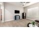 Neutral bedroom with light blue dresser, ceiling fan, wine cooler and large window at 16201 S 29Th Ave, Phoenix, AZ 85045