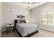 Bedroom featuring a ceiling fan and plantation shutters at 16201 S 29Th Ave, Phoenix, AZ 85045