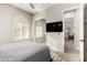 Bedroom with closet, ceiling fan, and a TV on the wall at 16201 S 29Th Ave, Phoenix, AZ 85045