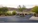 View of the gated entrance to the Summit community, featuring lush landscaping and mountain views at 16201 S 29Th Ave, Phoenix, AZ 85045