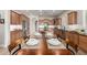 Open concept kitchen with stainless appliances, wood floors, cabinets and island with seating overlooking the dining area at 16201 S 29Th Ave, Phoenix, AZ 85045