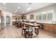 Large kitchen with an island, bar seating, wooden cabinets, stainless steel appliances, and a view into the living spaces at 16201 S 29Th Ave, Phoenix, AZ 85045
