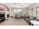 Spacious living room with a fireplace and comfortable seating with views into other rooms of the home at 16201 S 29Th Ave, Phoenix, AZ 85045