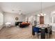 Open-concept living area with tile floors, modern furniture, and a piano, filled with natural light and stylish decor at 16201 S 29Th Ave, Phoenix, AZ 85045