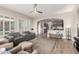 Open-concept living area flowing into a modern kitchen with a breakfast bar and ample natural light at 16201 S 29Th Ave, Phoenix, AZ 85045