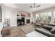 Inviting living room with a fireplace, large television, and comfortable seating, perfect for relaxation and entertainment at 16201 S 29Th Ave, Phoenix, AZ 85045
