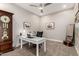 Well-lit office with a white desk, comfortable chair, and tasteful decorations at 16201 S 29Th Ave, Phoenix, AZ 85045