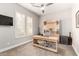 Office room with built-in shelving and desk near shuttered windows at 16201 S 29Th Ave, Phoenix, AZ 85045
