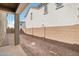 Enclosed backyard with stucco wall and exterior view of the two-story home at 1913 W Lariat Ln, Phoenix, AZ 85085
