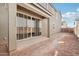 Spacious backyard featuring a covered patio with sliding glass doors, perfect for outdoor entertaining at 1913 W Lariat Ln, Phoenix, AZ 85085