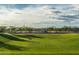 Community basketball court featuring covered seating and a lush green lawn at 1913 W Lariat Ln, Phoenix, AZ 85085