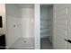 This is a picture of a white bathroom with a shower and a shelf at 1913 W Lariat Ln, Phoenix, AZ 85085