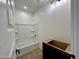 Bathroom with shower/tub combo and dark vanity cabinet with modern fixtures at 1913 W Lariat Ln, Phoenix, AZ 85085