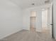 Bright bedroom featuring neutral carpet, fresh paint, and a walk-in closet for ample storage at 1913 W Lariat Ln, Phoenix, AZ 85085