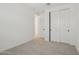 Small bedroom includes carpet, white walls, and closet with sliding doors at 1913 W Lariat Ln, Phoenix, AZ 85085