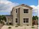 Charming two-story home with tan stucco, decorative roofline, and welcoming covered porch at 1913 W Lariat Ln, Phoenix, AZ 85085