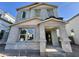 Modern two story home under construction featuring a covered porch and multiple windows at 1913 W Lariat Ln, Phoenix, AZ 85085