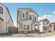 Charming two-story home with gray stucco, stone accents, and a welcoming front porch at 1913 W Lariat Ln, Phoenix, AZ 85085