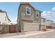 Well-maintained exterior of a two-story home with a two-car garage and a clean, modern aesthetic at 1913 W Lariat Ln, Phoenix, AZ 85085