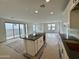 Beautiful kitchen features a large island, white cabinets, and stainless steel appliances and tile floors at 1913 W Lariat Ln, Phoenix, AZ 85085