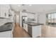 Bright kitchen features stainless appliances, gray counters, tile backsplash, and central island at 1913 W Lariat Ln, Phoenix, AZ 85085