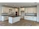 Bright kitchen features white cabinets, dark countertops, and a large island with lots of storage at 1913 W Lariat Ln, Phoenix, AZ 85085
