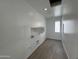 An inside look at a laundry room with wood look floors and white walls at 1913 W Lariat Ln, Phoenix, AZ 85085