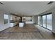 Open concept living space with kitchen and access to patio or backyard sliding glass door at 1913 W Lariat Ln, Phoenix, AZ 85085