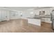 Open living space with tile floors, a kitchen island, and lots of natural light at 1913 W Lariat Ln, Phoenix, AZ 85085