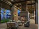 Outdoor patio space featuring cozy seating, a fireplace, and views of the community pool at 1913 W Lariat Ln, Phoenix, AZ 85085
