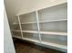 Walk-in pantry offers ample storage space with built-in shelving in this new home at 1913 W Lariat Ln, Phoenix, AZ 85085