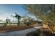 Community playground with climbing features, swings, and lush landscaping offer a recreational space for residents at 1913 W Lariat Ln, Phoenix, AZ 85085