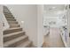 Bright staircase with carpeted steps, leading to an open-concept layout at 1913 W Lariat Ln, Phoenix, AZ 85085