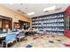 Large activity room with tables, chairs and shelving filled with craft items at 20455 N Lemon Drop Dr, Maricopa, AZ 85138