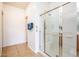 Bathroom with a glass enclosed shower and tile floors at 20455 N Lemon Drop Dr, Maricopa, AZ 85138