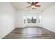 Light filled bedroom with wood-look flooring and a bright bay window offering neighborhood views at 20455 N Lemon Drop Dr, Maricopa, AZ 85138