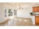 Bright and airy living area with tile flooring, ample natural light, and an open concept design at 20455 N Lemon Drop Dr, Maricopa, AZ 85138
