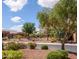 Beautiful street view showcasing mature trees and well-manicured landscaping in a peaceful neighborhood at 20455 N Lemon Drop Dr, Maricopa, AZ 85138