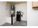 Efficient utility room featuring a water heater and water filtration system for clean and reliable home water supply at 20455 N Lemon Drop Dr, Maricopa, AZ 85138
