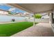 Backyard featuring green turf, a brick paver patio, and a block wall for privacy at 20866 W Hamilton St, Buckeye, AZ 85396