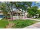 Picturesque single-story home featuring an inviting front porch and well-kept lawn at 20866 W Hamilton St, Buckeye, AZ 85396