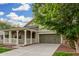 Well-maintained single-Gathering home with a welcoming porch, a two-car garage, and vibrant greenery at 20866 W Hamilton St, Buckeye, AZ 85396