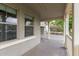 Cozy front porch with white railings, offering a glimpse of the home's exterior and surrounding landscape at 20866 W Hamilton St, Buckeye, AZ 85396