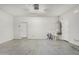 Spacious garage featuring bright lighting, painted walls, and a water heater at 20866 W Hamilton St, Buckeye, AZ 85396