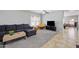 Comfortable living room with plush sectional sofa, bright windows, ceiling fan, and neutral decor at 2109 S Luther --, Mesa, AZ 85209