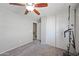 Cozy bedroom with a ceiling fan, neutral walls, closet, and carpeted floor at 2109 S Luther --, Mesa, AZ 85209