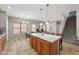 The kitchen features a large island with seating that opens to the dining and living area at 2109 S Luther --, Mesa, AZ 85209